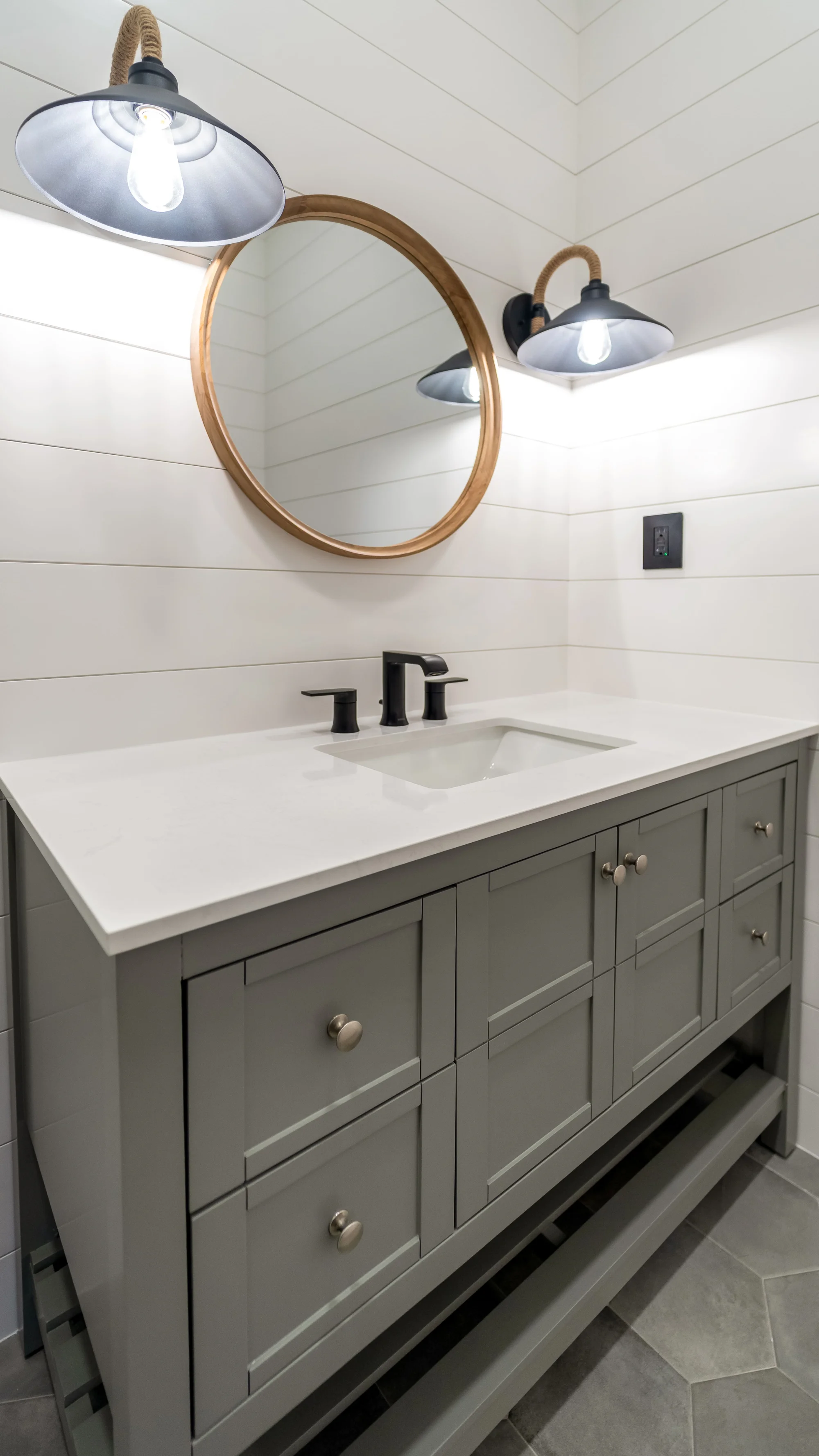 Luxury spa bathroom with marble tiles and designer fixtures in The Emerald Mediterranean revival home at 210 16th Ave NE, Naples FL by XL Homes custom home builder