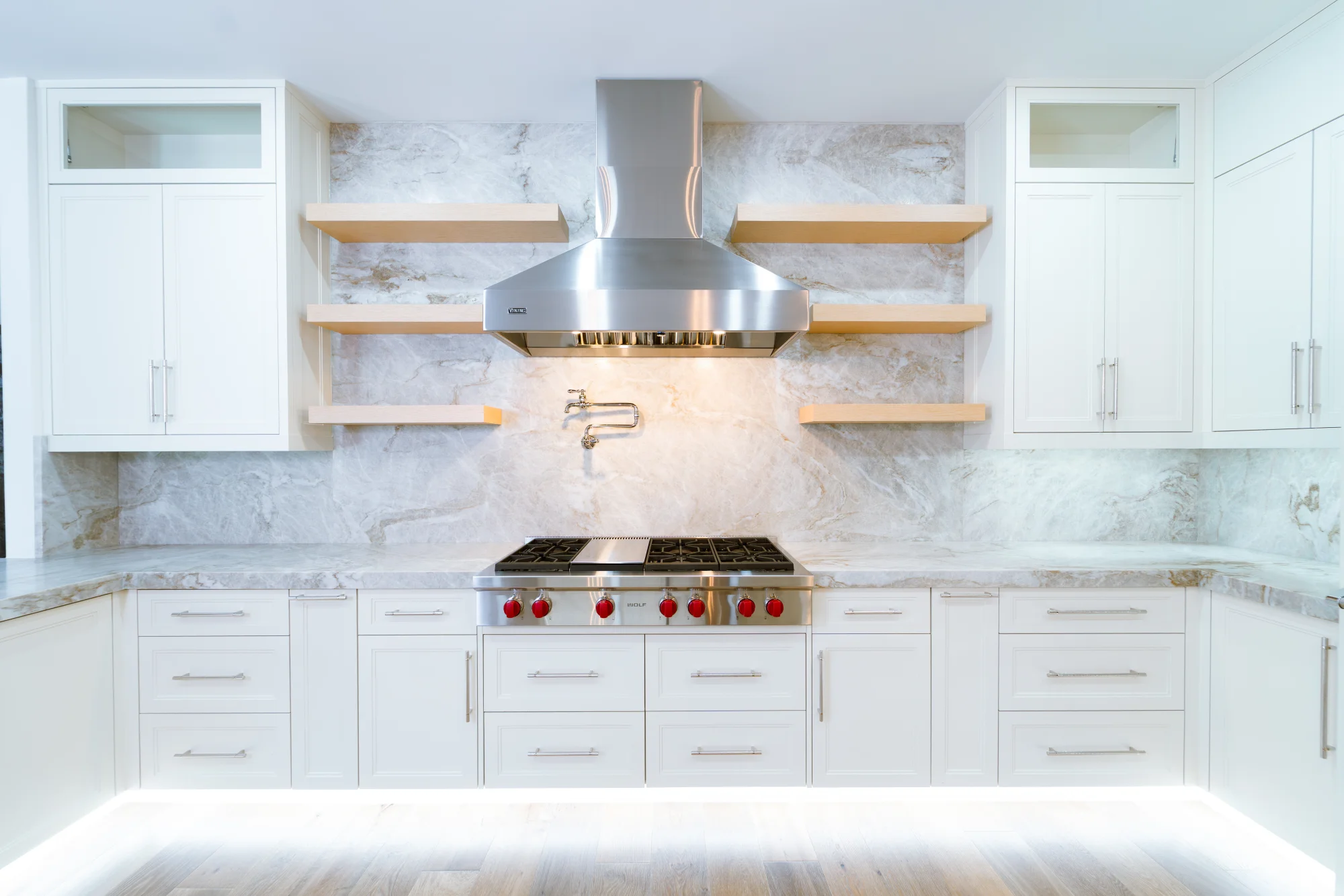 Gourmet kitchen with quartz countertops and custom cabinetry in The Emerald Mediterranean revival home at 210 16th Ave NE, Naples FL by XL Homes custom home builder