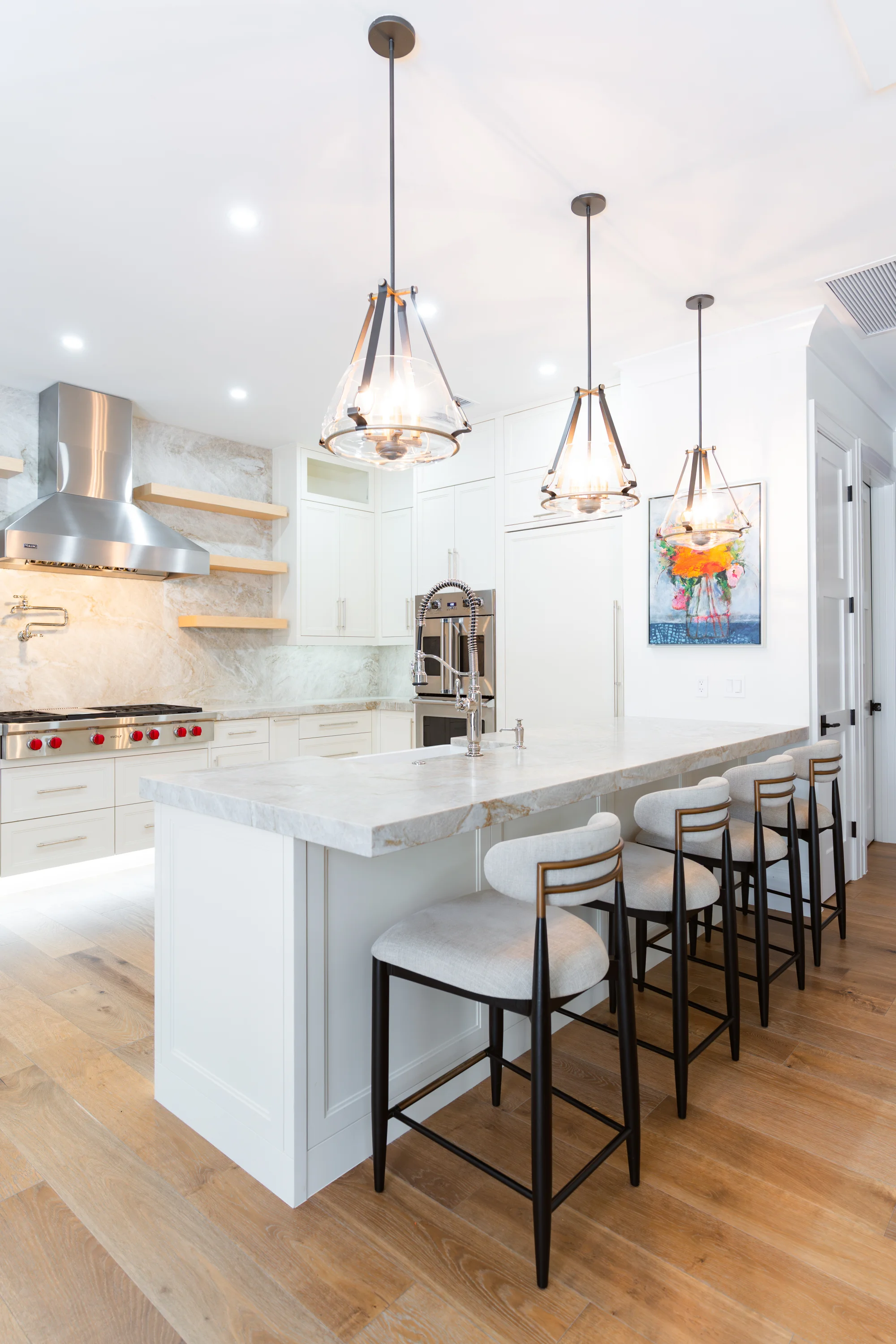 Gourmet kitchen with quartz countertops and custom cabinetry in The Emerald Mediterranean revival home at 210 16th Ave NE, Naples FL by XL Homes custom home builder