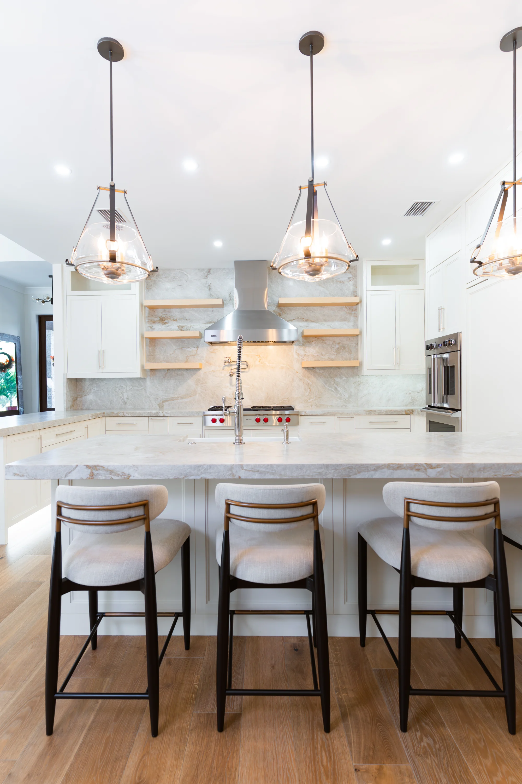 Gourmet kitchen with quartz countertops and custom cabinetry in The Emerald Mediterranean revival home at 210 16th Ave NE, Naples FL by XL Homes custom home builder
