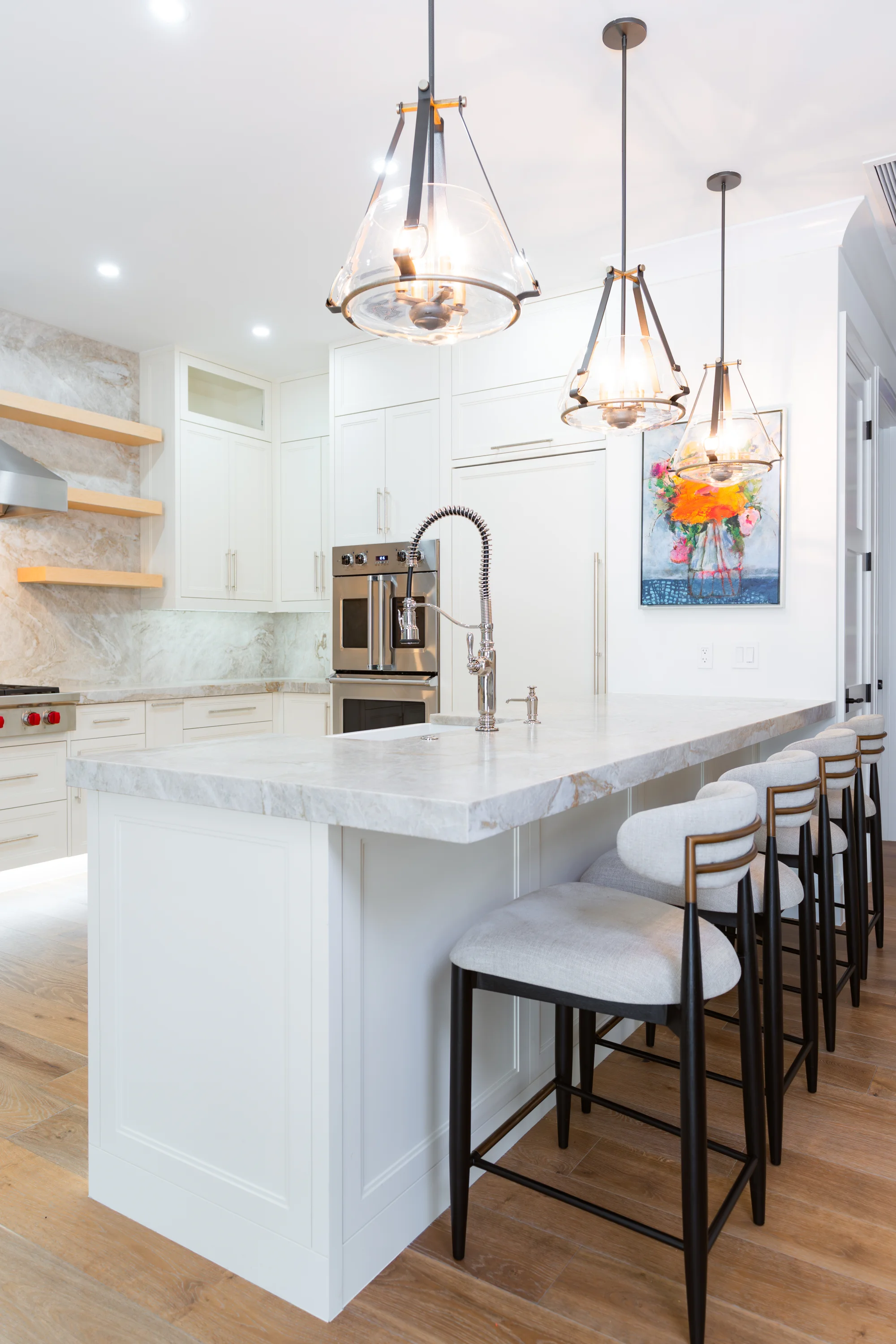Gourmet kitchen with quartz countertops and custom cabinetry in The Emerald Mediterranean revival home at 210 16th Ave NE, Naples FL by XL Homes custom home builder