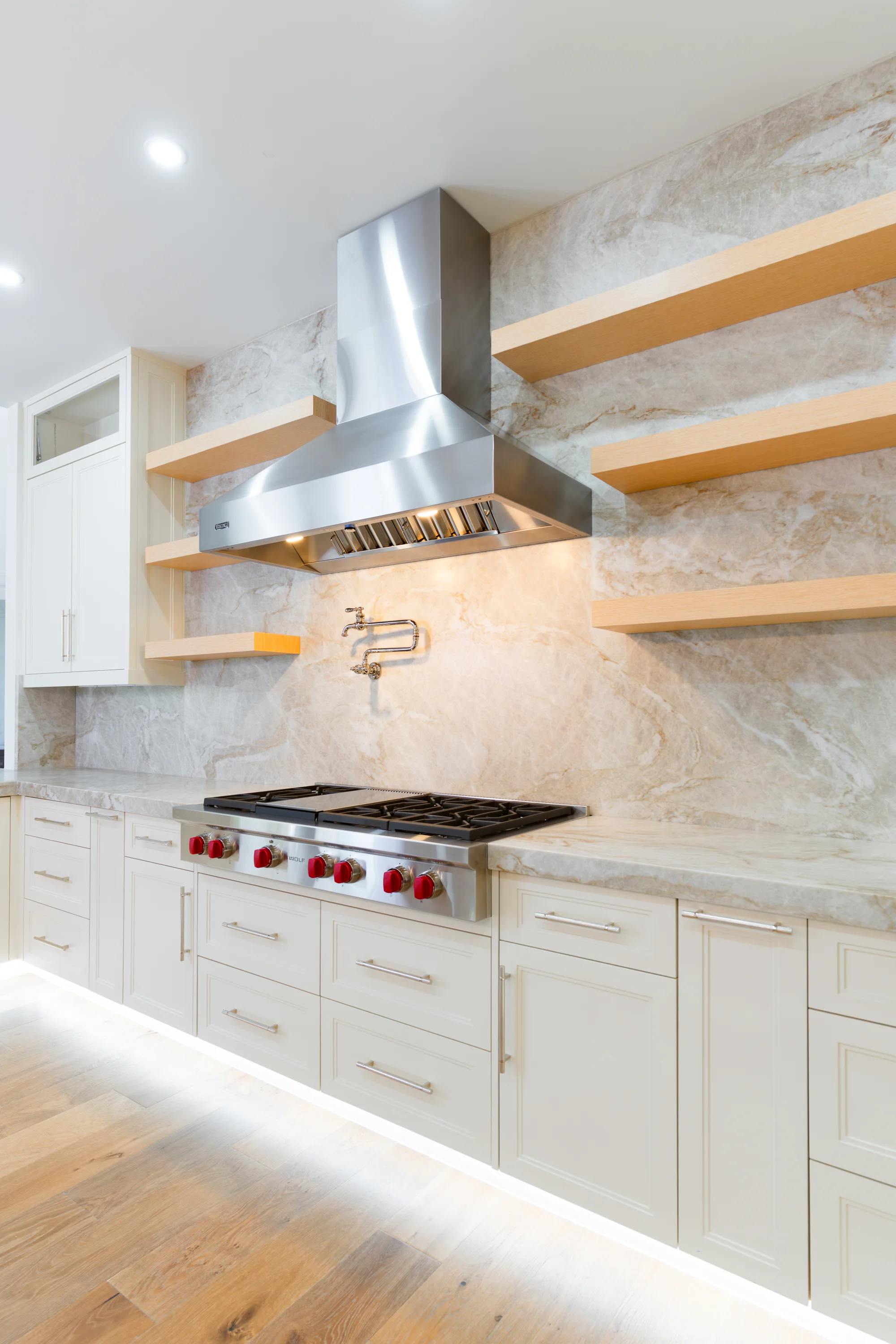 Gourmet kitchen with quartz countertops and custom cabinetry in The Emerald Mediterranean revival home at 210 16th Ave NE, Naples FL by XL Homes custom home builder