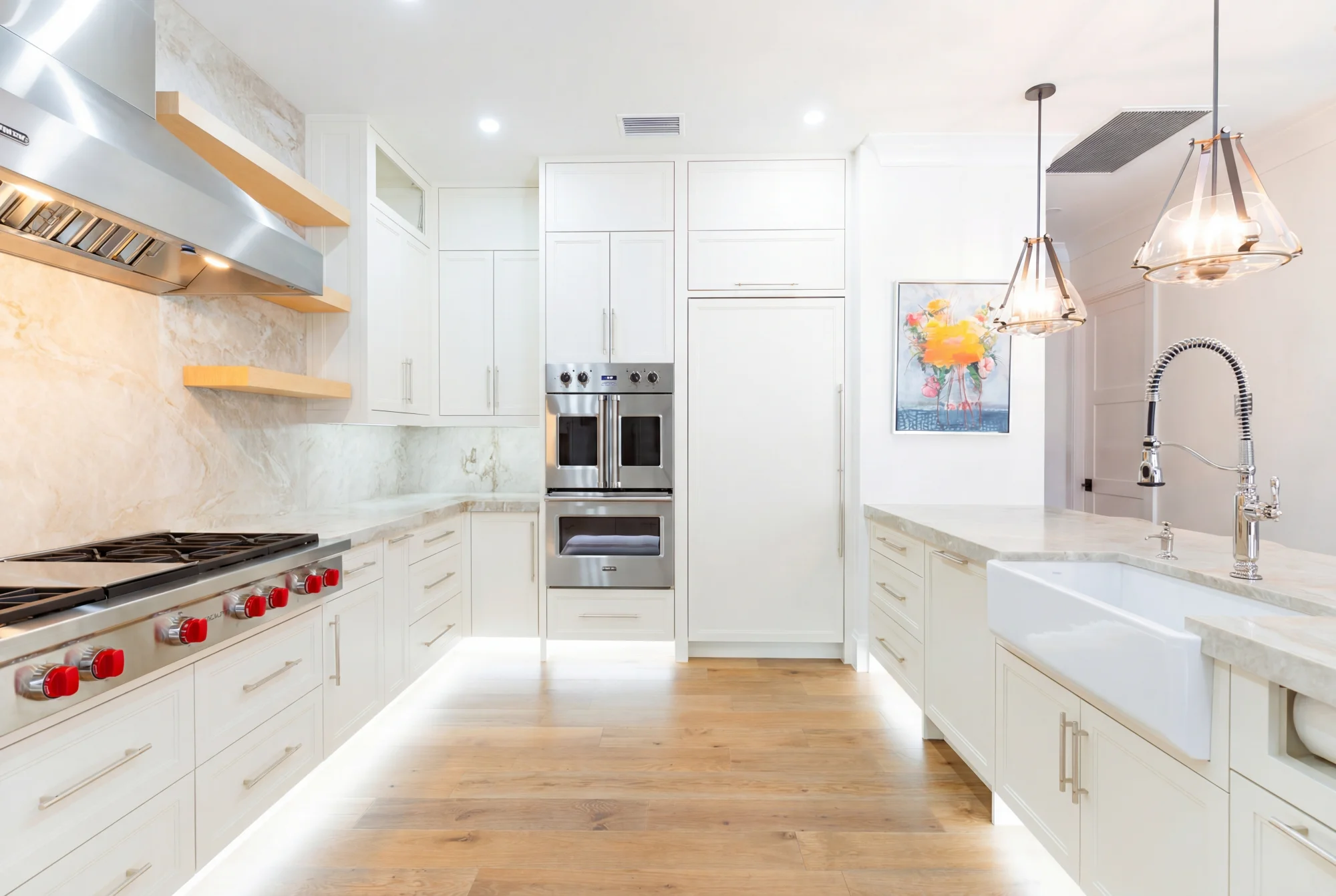 Gourmet kitchen with quartz countertops and custom cabinetry in The Emerald Mediterranean revival home at 210 16th Ave NE, Naples FL by XL Homes custom home builder