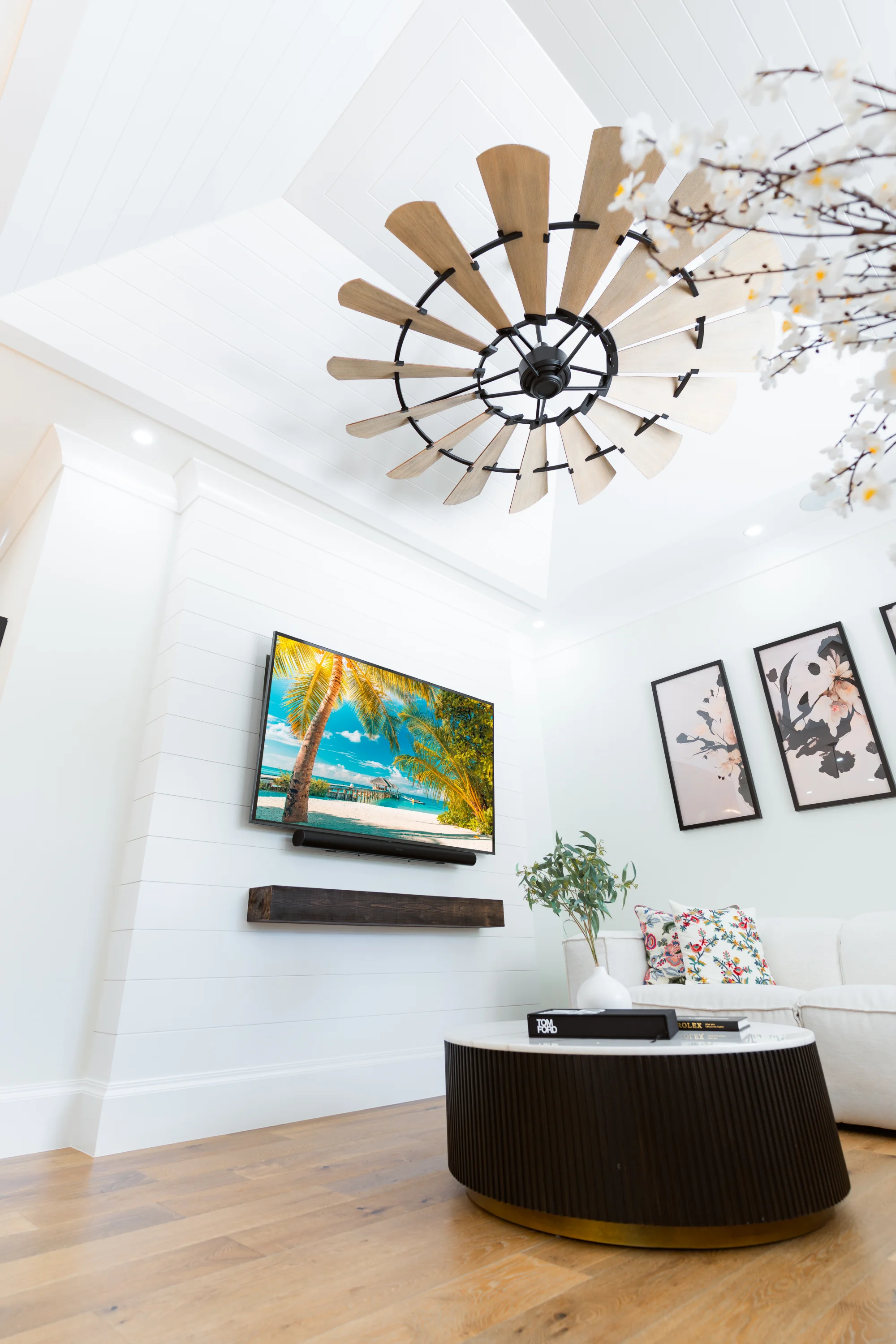 Open concept living room with high ceilings and natural light in The Emerald Mediterranean revival home at 210 16th Ave NE, Naples FL by XL Homes custom home builder
