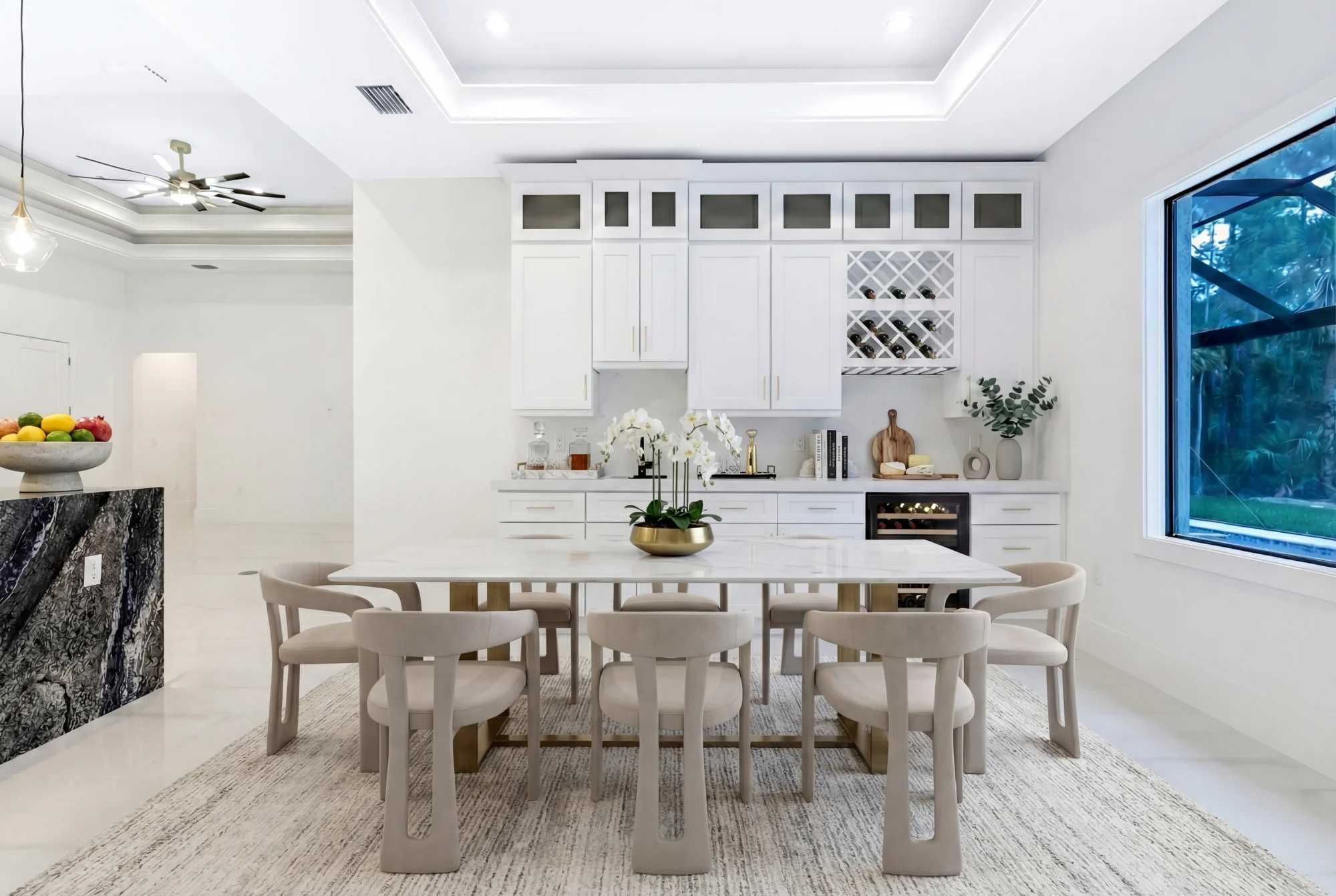 Custom home bar with premium finishes and lighting in Sunset Golf modern golf estate home at 524 22nd Ave NW, Naples FL by XL Homes custom home builder
