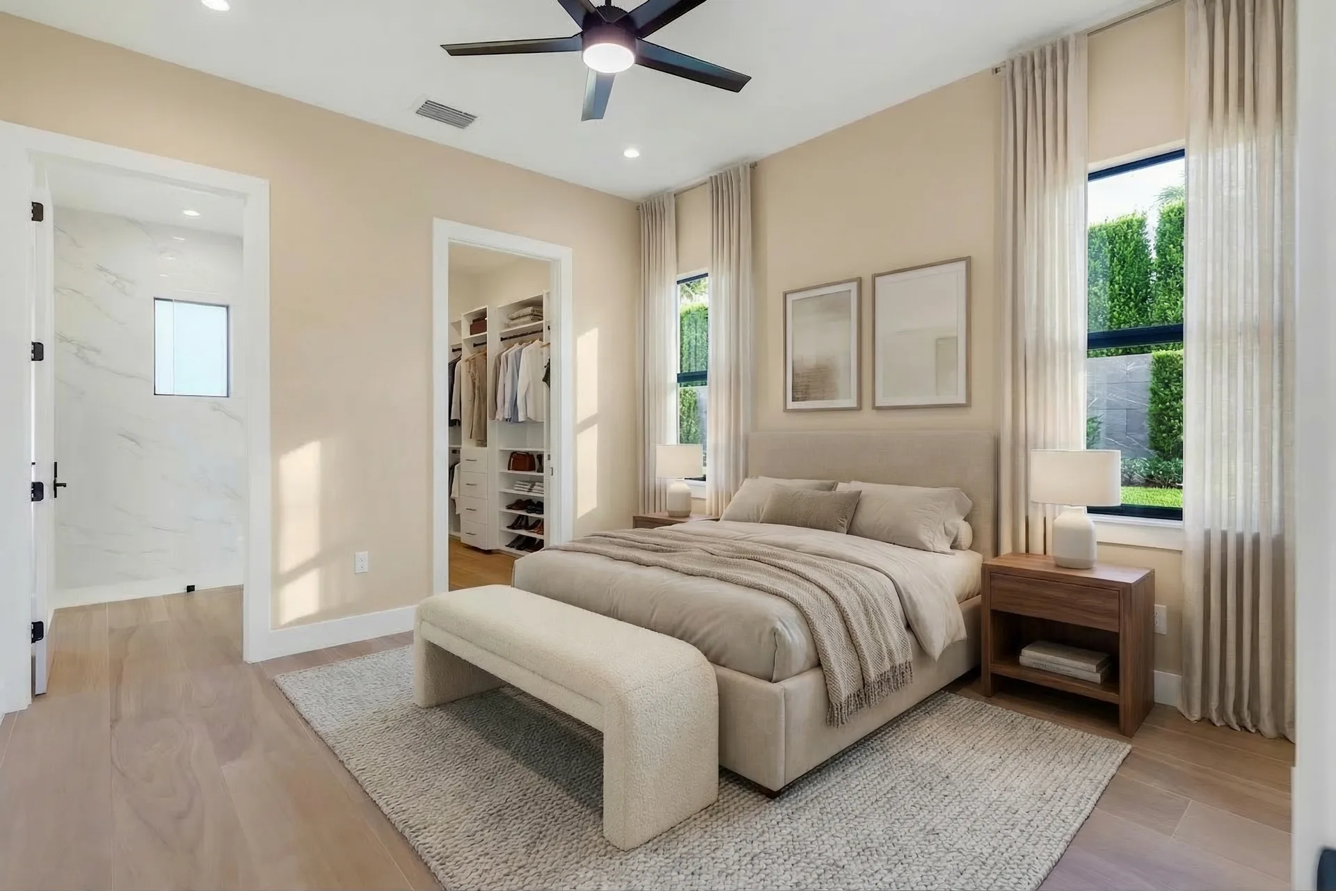 Spacious master suite with tray ceiling and custom millwork in Golden Ridge modern luxury estate home at Naples, FL by XL Homes custom home builder