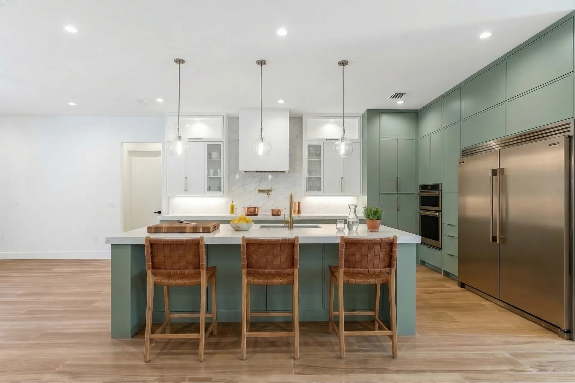 Gourmet kitchen with quartz countertops and custom cabinetry in Golden Ridge modern luxury estate home at Naples, FL by XL Homes custom home builder