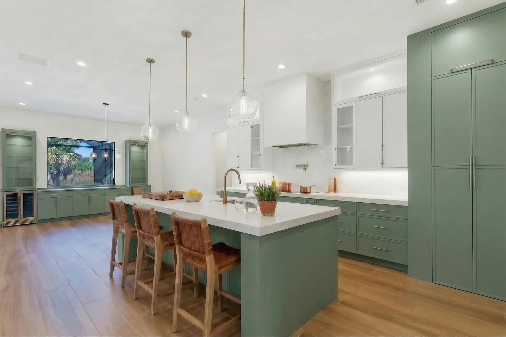 Gourmet kitchen with quartz countertops and custom cabinetry in Golden Ridge modern luxury estate home at Naples, FL by XL Homes custom home builder
