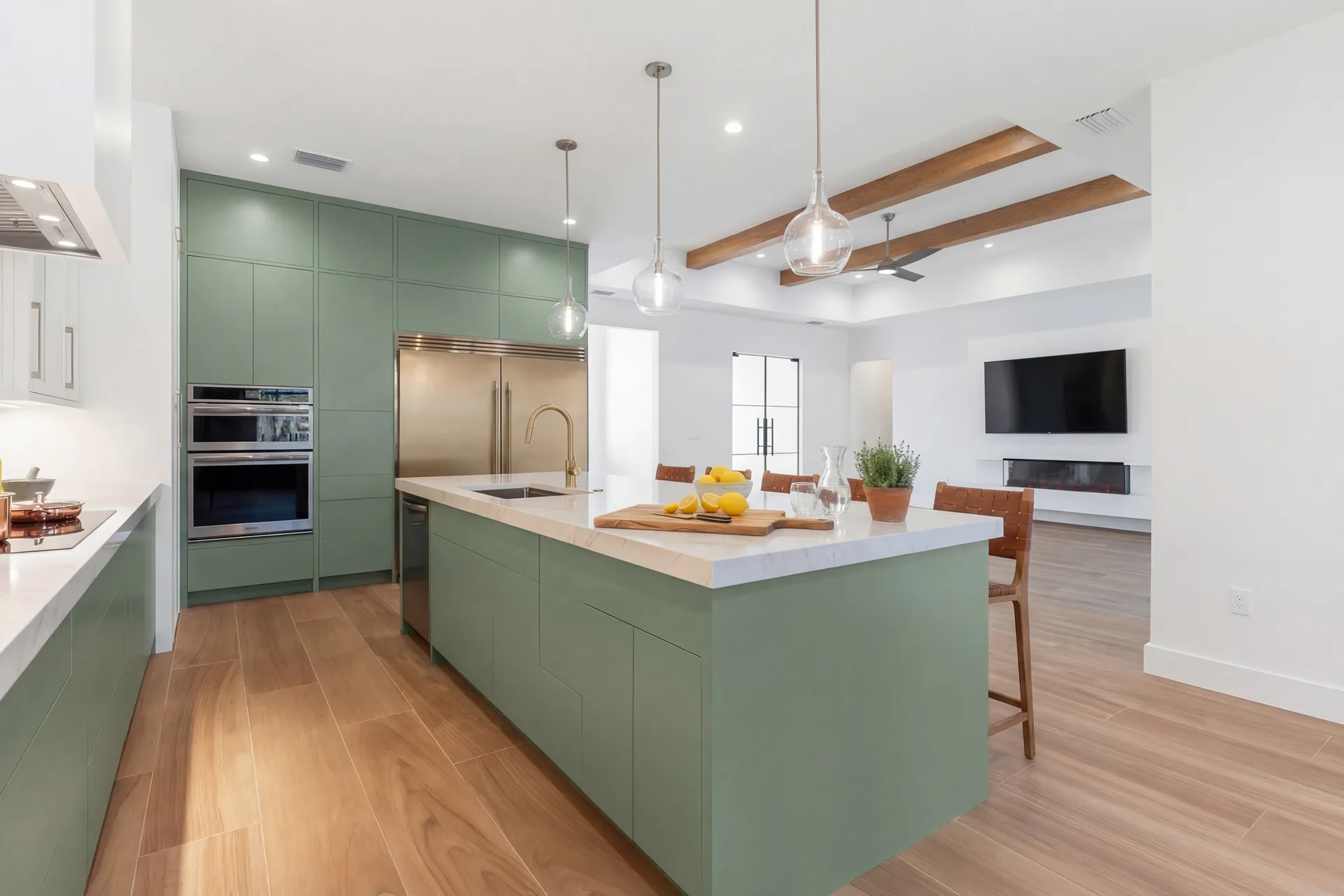 Gourmet kitchen with quartz countertops and custom cabinetry in Golden Ridge modern luxury estate home at Naples, FL by XL Homes custom home builder