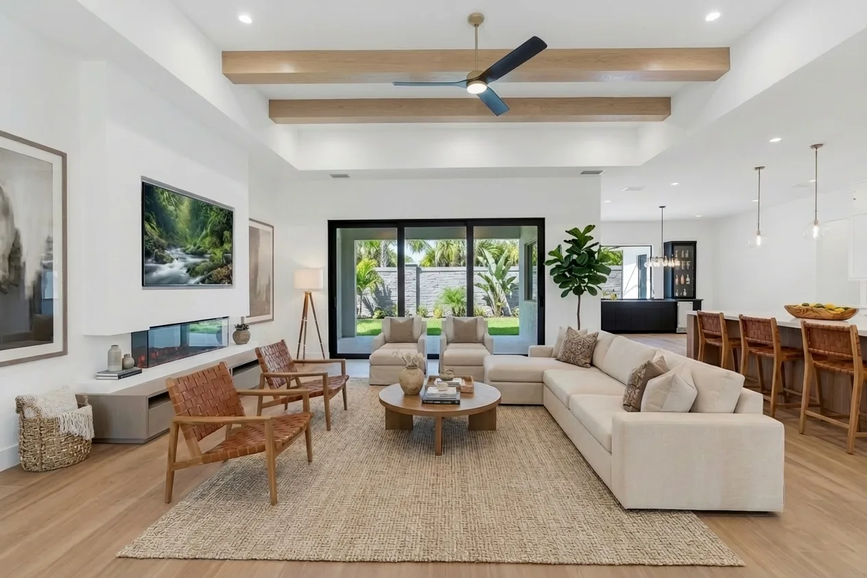 Open concept living room with high ceilings and natural light in Golden Ridge modern luxury estate home at Naples, FL by XL Homes custom home builder