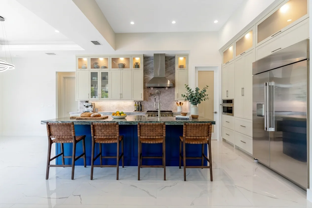 Gourmet kitchen with quartz countertops and custom cabinetry in Rookery Bay transitional coastal luxury home at Naples, FL by XL Homes custom home builder