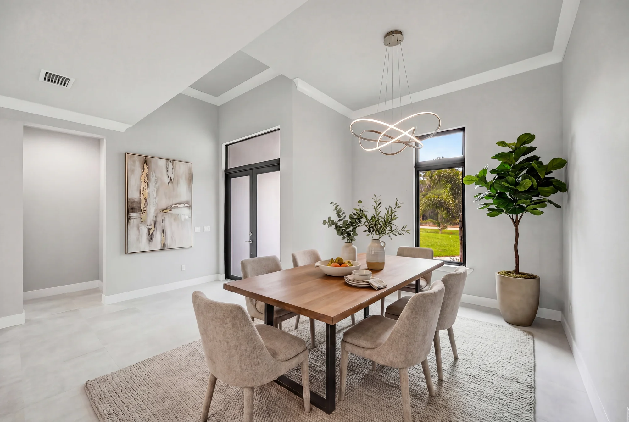 Elegant formal dining room with coffered ceiling in The Panorama Florida contemporary home at 70 33rd Ave NW, Naples FL by XL Homes custom home builder