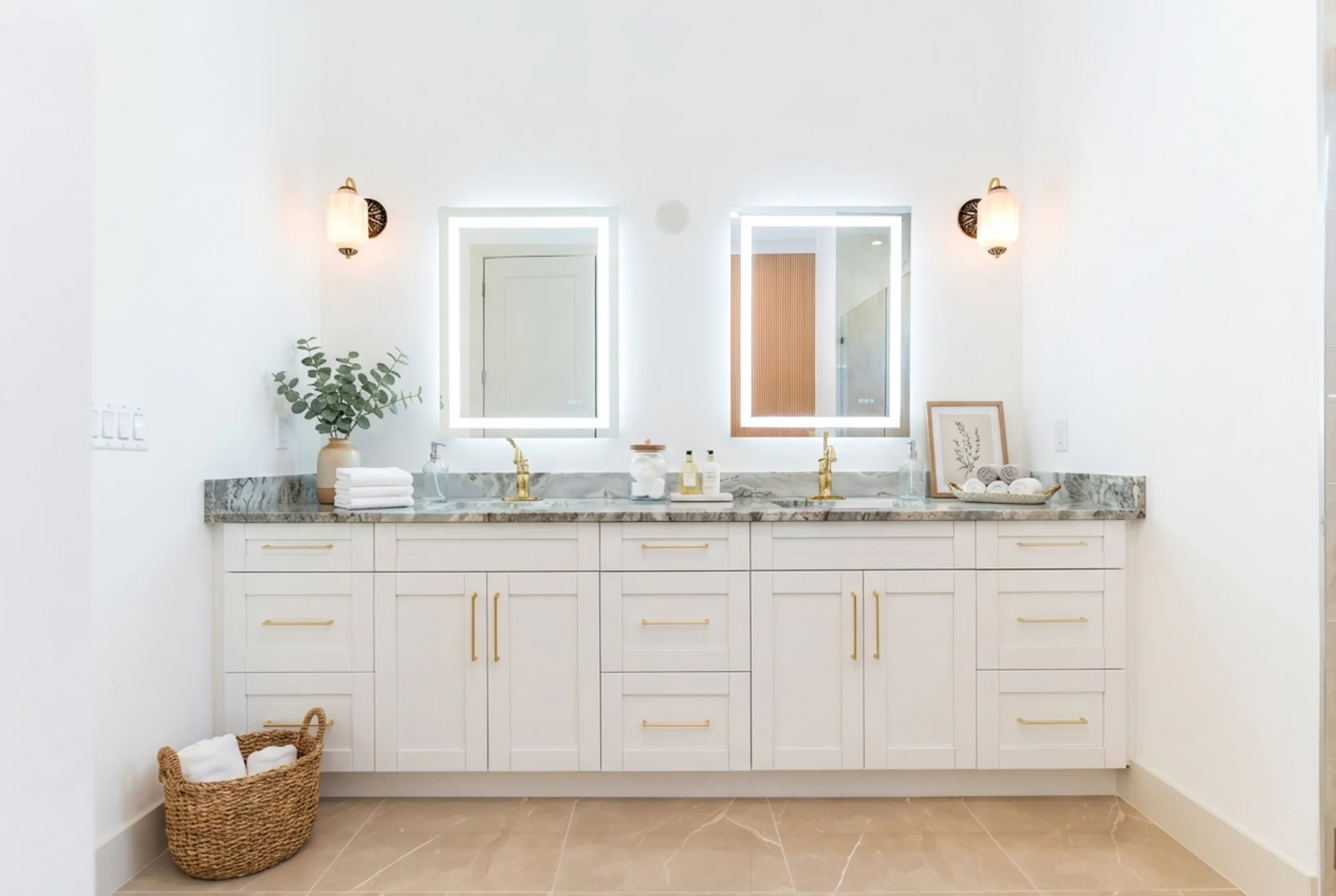 Luxury spa bathroom with marble tiles and designer fixtures in The Sapphire contemporary waterfront home at 619 22nd St SE, Naples FL by XL Homes custom home builder