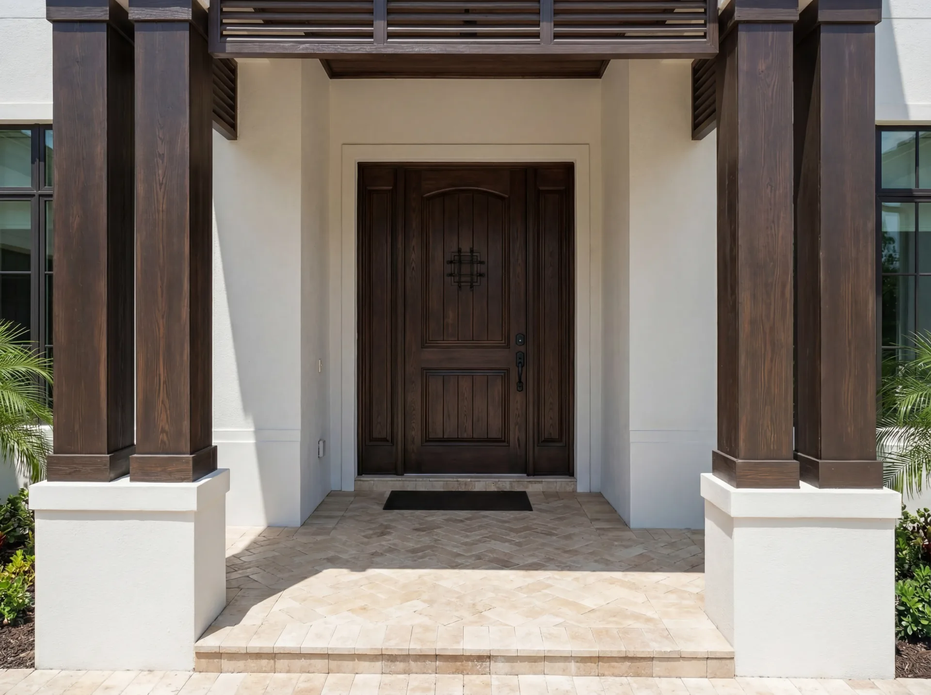 Modern Florida exterior architecture with tropical landscaping in Custom Residences luxury custom home at Naples, FL by XL Homes custom home builder