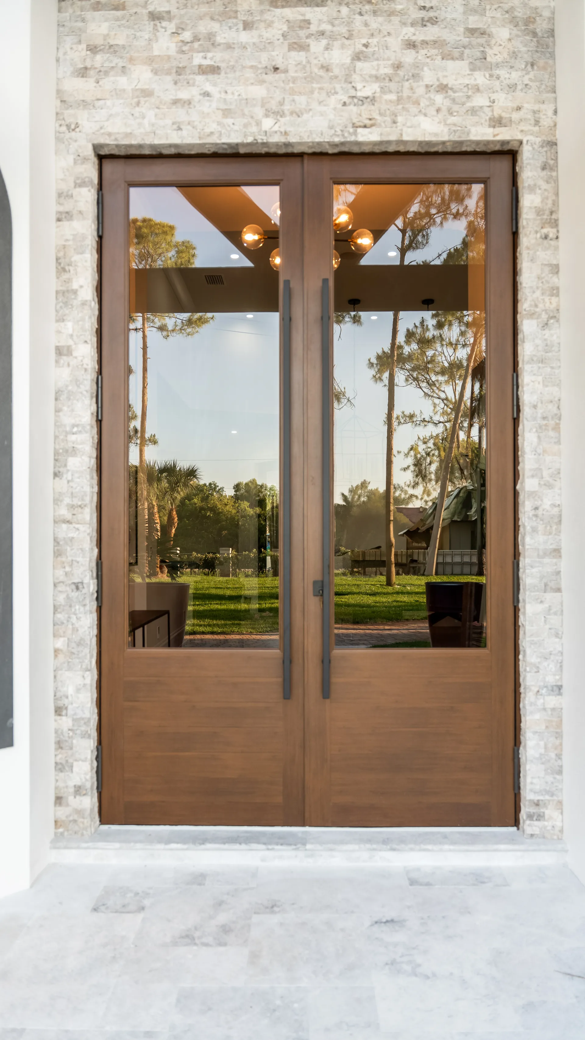 Modern Florida exterior architecture with tropical landscaping in Remodeling Projects high-end remodeling home at Naples, FL by XL Homes custom home builder