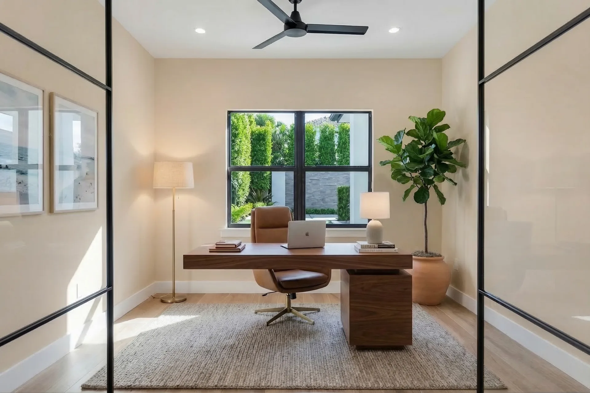 Executive home office with built-in shelving and desk in Remodeling Projects high-end remodeling home at Naples, FL by XL Homes custom home builder
